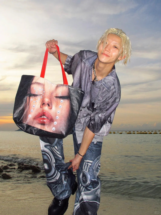 Bold fashion tote bag featuring artistic girl face with pearl tears – large capacity, trendy statement piece for styling and gifting.