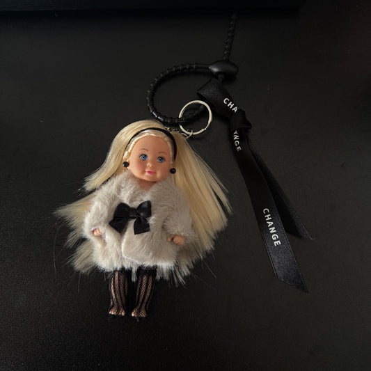 Barbie princess bag charm with fur outfit, cute and luxurious winter accessory for designer bags.
