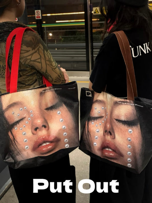 Bold fashion tote bag featuring artistic girl face with pearl tears – large capacity, trendy statement piece for styling and gifting.