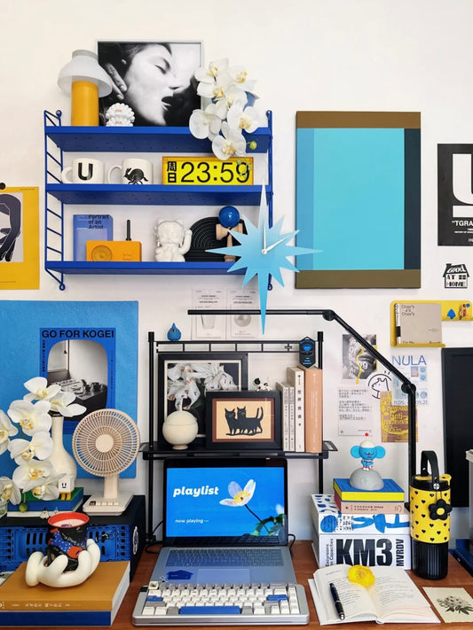 Blue acrylic wall clock with 12-pointed star shape, bold geometric design for modern home decor.