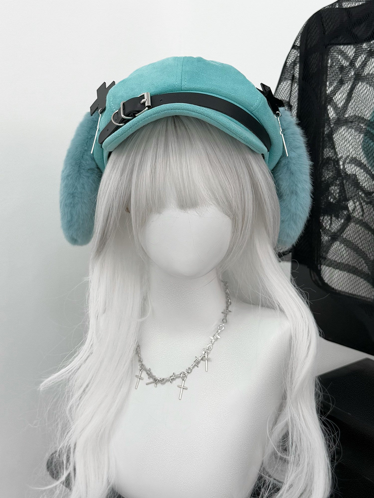 Mint green newsboy cap with long plush puppy ears, a black leather belt buckle, and metal cross charms, Hatsune Miku inspired aesthetic.