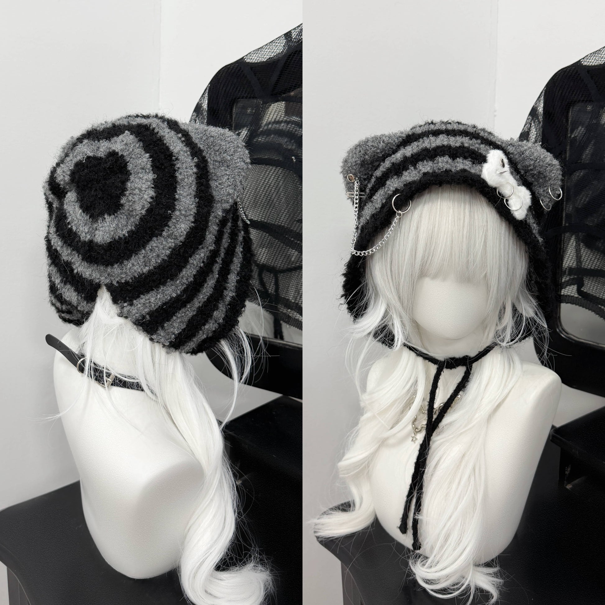 Distressed grey cat ear knit beanie with long buckle earflaps and contrast stitching.