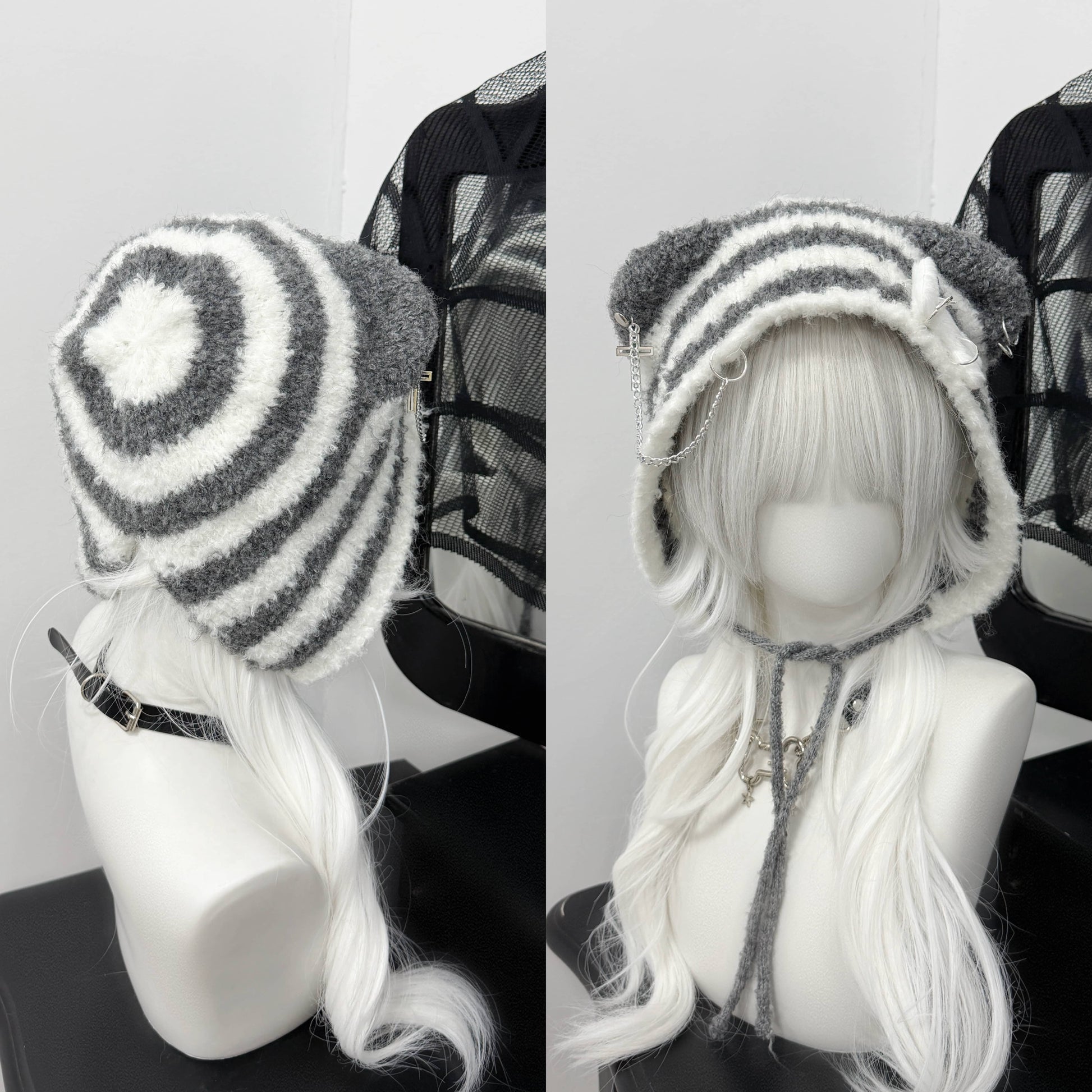 Distressed grey cat ear knit beanie with long buckle earflaps and contrast stitching.