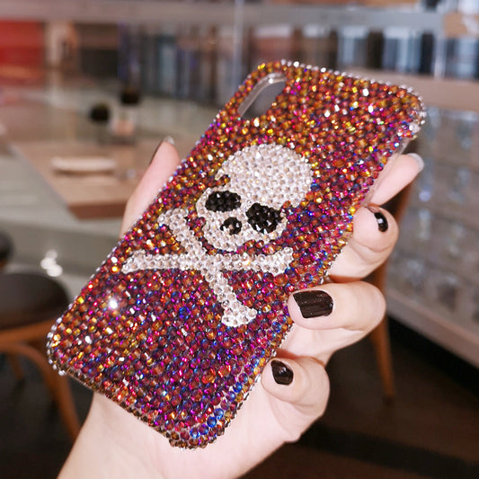 Handcrafted rhinestone skull phone case with a vibrant, shiny, and sparkling design, perfect for iPhone models.