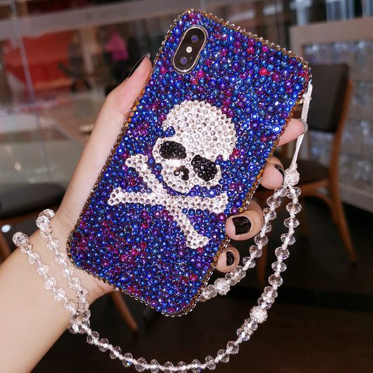  Shiny and sparkling handcrafted skull phone case with rhinestones, designed for a vibrant and edgy style, perfect for iPhone users.
