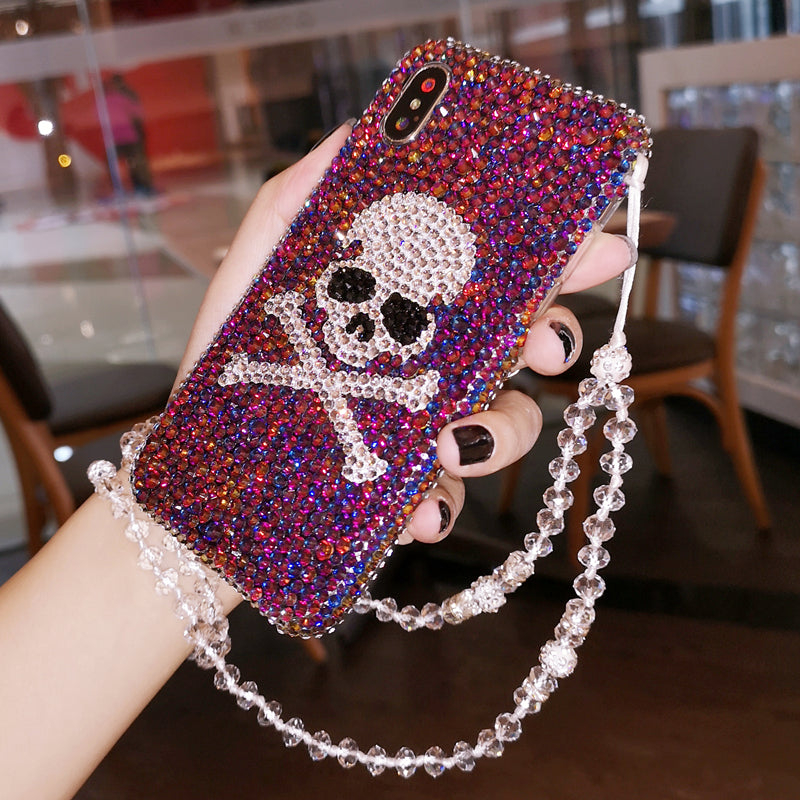 Vibrant skull rhinestone phone case, handcrafted and shiny, offering a bold look and durable protection for iPhone 12, 13, 14, 15, and 16 